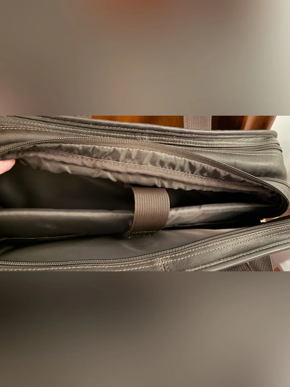 Wilson Leather dark brown leather expandable multi pocket laptop travel bag.